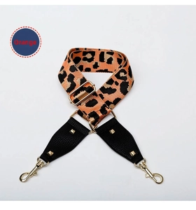 Detail of adjustable leopard print bag strap with gold studs and lobster clasps