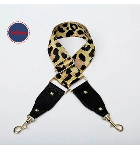 Adjustable leopard print wide bag strap with golden rivets and black leather details