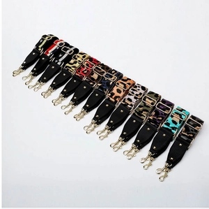 Close-up of adjustable leopard and camo patterned straps with golden metal hooks
