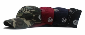 Detail of embroidered USA and Est 1987 lettering on washed denim baseball caps in multiple colors