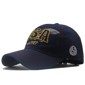 Navy blue denim baseball cap with vintage USA embroidery and a curved brim profile