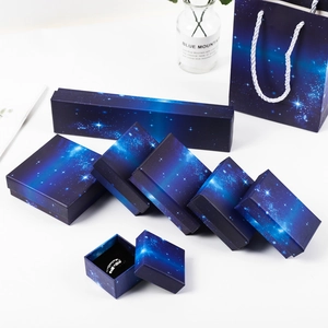 Detailed set of deep blue starry night jewelry gift boxes and matching paper bags