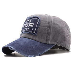Distressed vintage cotton baseball cap with nautical patch and frayed brim detail