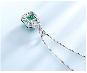 Macro view showing S925 hallmark and craftsmanship of square green gemstone pendant