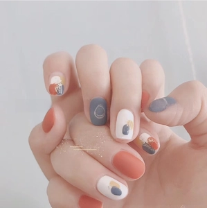 Detail of 3D summer nail stickers featuring abstract geometric patterns and smile icons