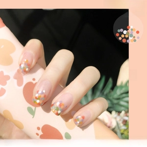 Detailed view of colorful 3D ultra-thin fruit nail stickers with vibrant polka dots