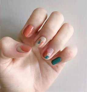Artistic 3D nail stickers featuring orange and dark green summer fruit patterns