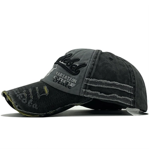 Detailed view of the distressed brim with Dakota print and Rebel 3D embroidery on the cap