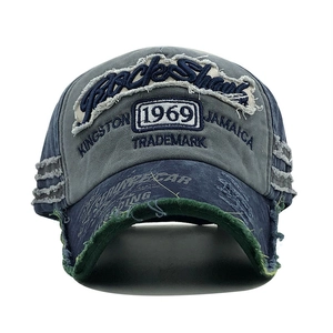 Detailed macro view of distressed 1969 vintage baseball cap with Black Shark embroidery