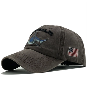 Distressed cotton baseball cap with shark embroidery and American flag patch details