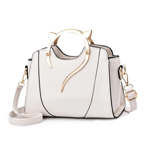 White handbag for women with unique gold cat-ear handles and adjustable shoulder strap