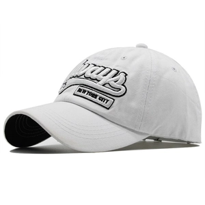 Detail view of white cotton baseball cap with Ways embroidery and New York City patch