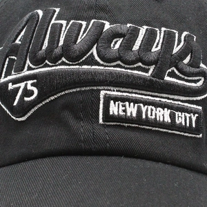 Detail of 3D layered Always and New York City embroidery on a black cotton baseball cap