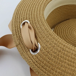 Women's woven straw sun hat with brown texture and elegant khaki ribbon detail