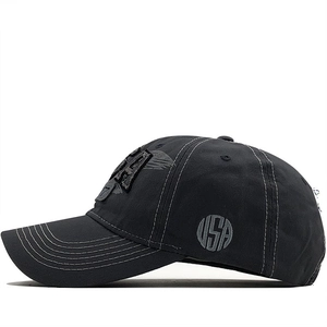 Detail of USA embroidery and white contrast stitching on the dark grey baseball cap