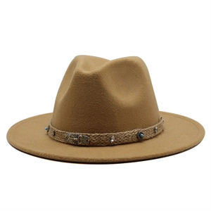 Close-up of camel wool fedora featuring a braided band with a metal scorpion and turquoise