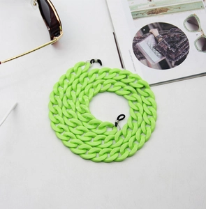Detail of bright green acrylic eyewear chain with adjustable rubber loops and metal rings