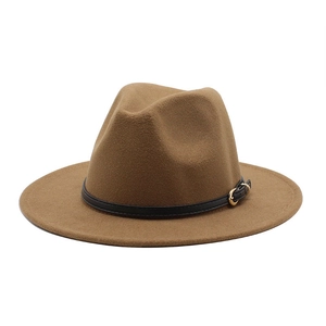 Detailed view of a brown wool fedora hat featuring a black leather belt with gold buckle