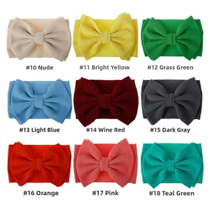 Nine colors of baby headbands featuring large bows and elastic waffle texture fabric