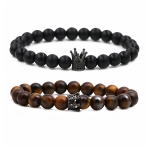 Tiger eye and matte black beaded crown bracelets set for couples on white background
