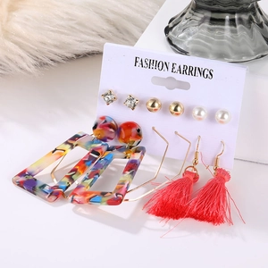 Detail of 6-piece earring set featuring red tassels and colorful resin geometric drops