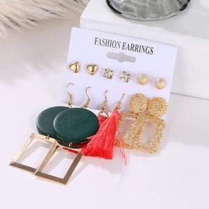 Detailed view of 6-pair gold earring set featuring red tassels and green wood-grain hoops
