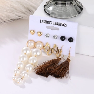 Detail view of 6-piece earring set with pearls, metal leaves and tassels on display card