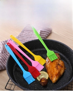Detailed view of integrated silicone oil brushes in five colors for baking and BBQ