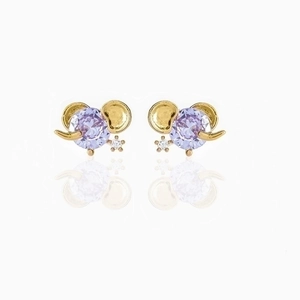 Macro shot of 18K gold plated elephant stud earring with purple zircon and white stones