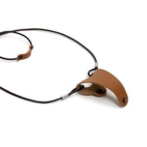 Faux leather eyewear cord with brown glasses storage pouch and metal buckle on white background