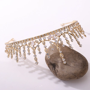Detailed view of bridal crown featuring teardrop rhinestones on dark stone base