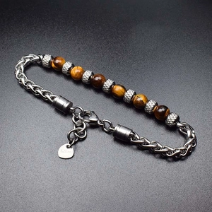 Detail of 6mm tiger eye stone beads combined with a 316L stainless steel chain bracelet