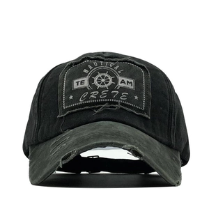 Detail of distressed cotton baseball cap with Nautical Team Crete patch and frayed edges