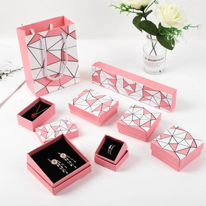 Pink geometric jewelry gift set with necklace, earring boxes and matching bags