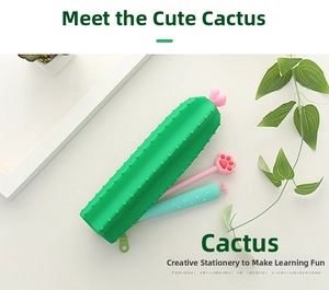 Close-up of green cactus silicone pencil case with heart zipper and cute stationery inside
