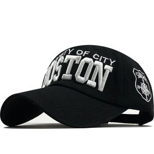 Black baseball cap with Boston embroidery and shield icon shown from a side angle