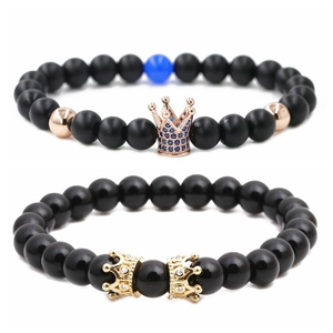 Matte black stone crown bead bracelet set with gold and blue metal ornaments