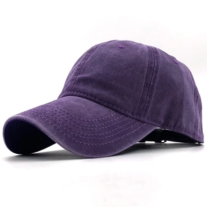 Detailed view of the washed cotton texture and stitching on this dark purple baseball cap
