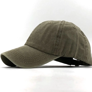 Detailed side view of washed cotton baseball cap in olive green with adjustable metal strap