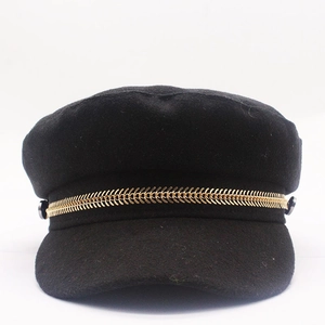 Elegant black wool newsboy cap with gold chain detail and vintage flat top design