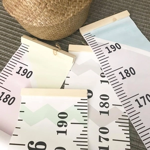 Detailed stack of canvas and wood height growth charts with clear measurement scales
