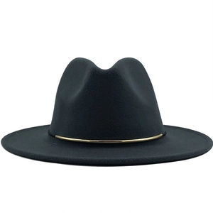 Detailed view of black wool fedora hat with a thin gold metal band on white background