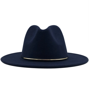 Detail of navy wool fedora hat featuring a slim gold metal decorative band detail