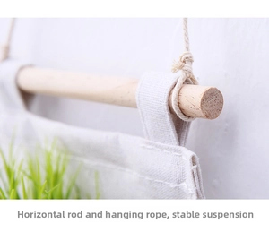 Detail of wooden rod and sturdy cotton rope on a minimalist hanging storage bag