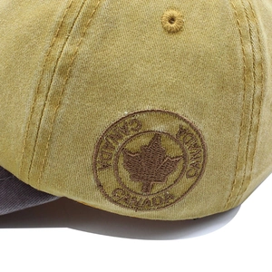 Washed cotton baseball cap in khaki with embroidered Canada maple leaf and round logo patch
