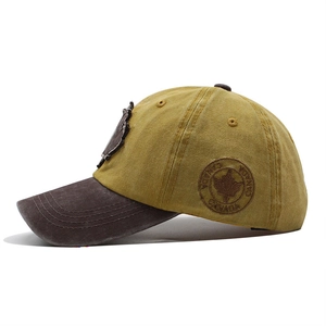 Close-up of the vintage mustard yellow cotton baseball cap with Canada maple leaf embroidery