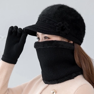 Detail of black winter knit hat, plush lined snood, and gloves set with floral decor