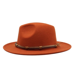 Classic orange felt fedora hat with wide brim and braided leather band for large head sizes