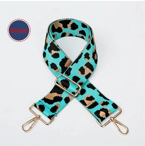 Close-up of leopard print wide replacement strap in green with gold metal hardware