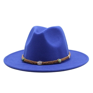 Detail of royal blue wool fedora with brown braided band and green bead accents